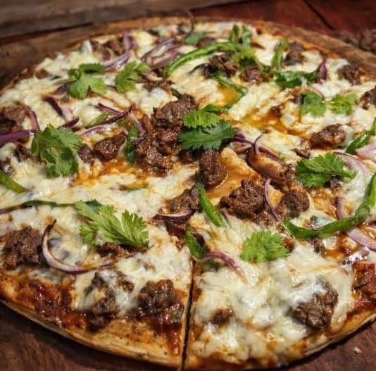 Pizza Especial de la Casa, suprema con vegetales